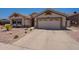 View of home highlighting garage, desert landscaping and front yard at 509 W Villa Rita Dr, Phoenix, AZ 85023