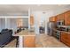 Modern kitchen with stainless steel appliances, granite countertops, and an island with a view to other rooms at 509 W Villa Rita Dr, Phoenix, AZ 85023