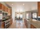 Bright kitchen featuring granite countertops, stainless steel appliances, and an adjacent dining area at 509 W Villa Rita Dr, Phoenix, AZ 85023