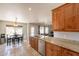 Well-lit kitchen featuring granite countertops, stainless steel appliances, and an open dining area and a backyard view at 509 W Villa Rita Dr, Phoenix, AZ 85023