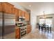 Modern kitchen features granite counters, stainless appliances, and a cozy dining area with backyard view at 509 W Villa Rita Dr, Phoenix, AZ 85023