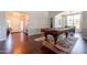 Spacious living room featuring hardwood floors, a pool table, and an open layout with ample natural light at 509 W Villa Rita Dr, Phoenix, AZ 85023