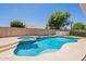 Backyard features a tranquil pool, spa, with desert landscaping at 509 W Villa Rita Dr, Phoenix, AZ 85023