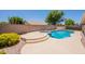 Resort-style backyard featuring a pool, spa, and low maintenance landscaping at 509 W Villa Rita Dr, Phoenix, AZ 85023