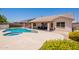 Serene backyard with a refreshing pool, patio, and well-maintained landscaping at 509 W Villa Rita Dr, Phoenix, AZ 85023