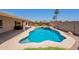 Private backyard showcasing a pristine pool, spa, covered patio and low maintenance landscaping at 509 W Villa Rita Dr, Phoenix, AZ 85023