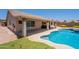 Inviting backyard with covered patio, refreshing pool, and landscaped surroundings at 509 W Villa Rita Dr, Phoenix, AZ 85023