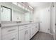 Bright bathroom with a double vanity, white cabinets, and modern fixtures for a clean, updated look at 533 E 7Th Pl, Mesa, AZ 85203