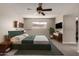 Comfortable bedroom featuring a ceiling fan, window, and complementary decor at 533 E 7Th Pl, Mesa, AZ 85203
