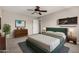 Relaxing bedroom with ceiling fan, modern decor, and an inviting space at 533 E 7Th Pl, Mesa, AZ 85203