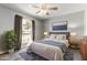 Bright bedroom with large windows, ceiling fan, and natural light at 533 E 7Th Pl, Mesa, AZ 85203
