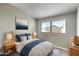 Cozy bedroom featuring a comfortable bed, stylish decor, and a bright window offering natural light and views at 533 E 7Th Pl, Mesa, AZ 85203