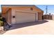 Attached two-car garage with a neutral door and brick and siding exterior at 533 E 7Th Pl, Mesa, AZ 85203