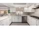 Open kitchen featuring white countertops, modern appliances, and ample cabinet space at 533 E 7Th Pl, Mesa, AZ 85203