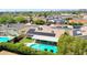 Aerial view of house with a well-maintained backyard pool, patio, and solar panels at 5349 W Acapulco Ln, Glendale, AZ 85306