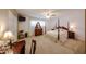 Spacious bedroom with a four-poster bed, dresser, and ample natural light at 5349 W Acapulco Ln, Glendale, AZ 85306