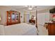 Bright bedroom featuring a four-poster bed, vintage furniture, and neutral décor at 5349 W Acapulco Ln, Glendale, AZ 85306