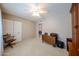 Bedroom featuring a ceiling fan, carpet, and a foldable wooden table at 5349 W Acapulco Ln, Glendale, AZ 85306