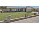 Traditional home with a well-kept lawn, brick accents, and a welcoming facade at 5349 W Acapulco Ln, Glendale, AZ 85306