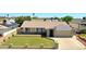Attractive single-story residence featuring a well-kept lawn, tidy landscaping, and a convenient two-car garage at 5349 W Acapulco Ln, Glendale, AZ 85306