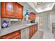 Traditional kitchen with granite countertops, custom cabinetry, and an undermount sink at 5349 W Acapulco Ln, Glendale, AZ 85306