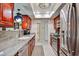 Cozy kitchen featuring warm wood cabinets, granite counters, and stainless steel appliances at 5349 W Acapulco Ln, Glendale, AZ 85306
