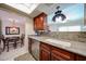 Kitchen sink and countertop next to the dining room table at 5349 W Acapulco Ln, Glendale, AZ 85306