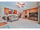This living room features access to the dining room, a brick fireplace and neutral colored furnishings at 5349 W Acapulco Ln, Glendale, AZ 85306