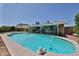 A refreshing backyard pool with a large patio and a covered seating area, ideal for entertaining or enjoying the sun at 5349 W Acapulco Ln, Glendale, AZ 85306
