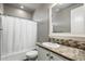 Bathroom with a shower and tub combination, modern vanity, and neutral color scheme at 650 N Hawes Rd # 3424, Mesa, AZ 85207