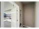Mudroom features a white door, storage for cleaning tools, and a convenient place to hang coats at 650 N Hawes Rd # 3424, Mesa, AZ 85207