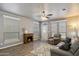 Cozy living room featuring a fireplace, plush seating, and lots of natural light at 650 N Hawes Rd # 3424, Mesa, AZ 85207