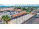 Aerial view of shuffleboard courts and clubhouse, showing the array of community activities and gathering spots at 650 N Hawes Rd # 3424, Mesa, AZ 85207