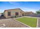 Charming backyard featuring artificial turf, desert landscaping, and a peaceful outdoor space at 654 E Buckingham Ave, Gilbert, AZ 85297