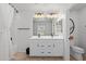 This bathroom features a double sink vanity, tile floors, and a shower with curtain at 654 E Buckingham Ave, Gilbert, AZ 85297