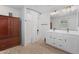 Bright bathroom featuring a double sink vanity, tile floors, and a shower with curtain at 654 E Buckingham Ave, Gilbert, AZ 85297