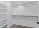 Walk-in closet provides ample storage space with built-in shelving and hanging rods at 654 E Buckingham Ave, Gilbert, AZ 85297