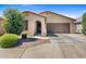 Charming single-story home featuring a two-car garage, stucco exterior, and a well-manicured front yard at 654 E Buckingham Ave, Gilbert, AZ 85297
