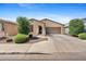 Attractive single-Gathering home featuring a well-kept yard with desert landscaping and a spacious driveway at 654 E Buckingham Ave, Gilbert, AZ 85297