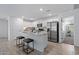 Bright kitchen features granite countertops, stainless steel appliances, and a kitchen island with seating at 654 E Buckingham Ave, Gilbert, AZ 85297