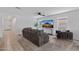 Comfortable living room with neutral tones, carpeted floors, a ceiling fan, and ample natural light at 654 E Buckingham Ave, Gilbert, AZ 85297