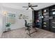Home office with black shelving, a work station, and a light-filled window at 654 E Buckingham Ave, Gilbert, AZ 85297
