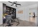 Home office with black shelving and desk space, next to bedroom at 654 E Buckingham Ave, Gilbert, AZ 85297