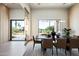 Elegant dining room with modern lighting, offering a view of the landscaped front yard at 6702 E Cholla St, Scottsdale, AZ 85254