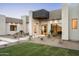 Modern home exterior showcasing desert landscaping, a walkway, and a unique architectural design at 6702 E Cholla St, Scottsdale, AZ 85254
