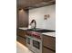 Modern kitchen featuring a Wolf range, pot filler, custom cabinets, and high-end finishes at 6702 E Cholla St, Scottsdale, AZ 85254