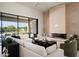 Cozy living room featuring a modern fireplace, comfortable seating, and large windows at 6702 E Cholla St, Scottsdale, AZ 85254