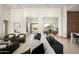 Bright living room with modern decor, open layout, and views to both the front and rear of the home at 6702 E Cholla St, Scottsdale, AZ 85254