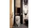 Unique powder room featuring marble accents, modern fixtures, and elegant design at 6702 E Cholla St, Scottsdale, AZ 85254