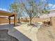 Spacious backyard featuring a built-in bar, fireplace, fire pit, and outdoor seating area at 6712 W Northview Ave, Glendale, AZ 85303